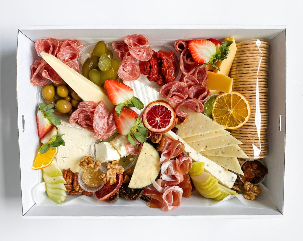 Small Cheese & Charcuterie Box includes cured meats, 6 cheeses, olives, fresh fruit, candied nuts, crackers and  honeycomb